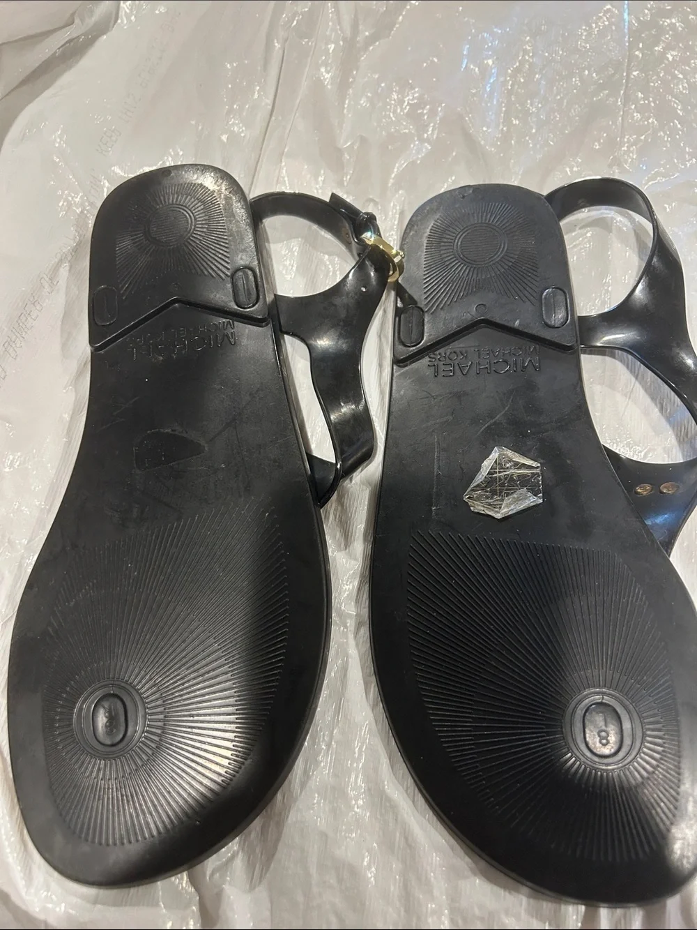 Michael Kors Black Jelly Logo Thong Sandals with Gold MK Medallion